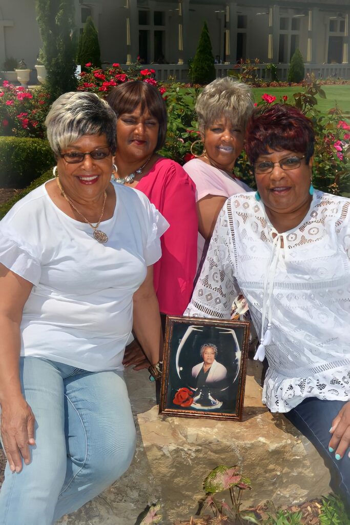 A photo of the sisters surrounding a photo of their late mother